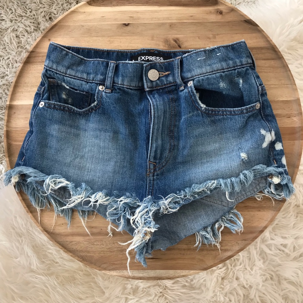 High rise cheeky distressed denim jean shorts. 2